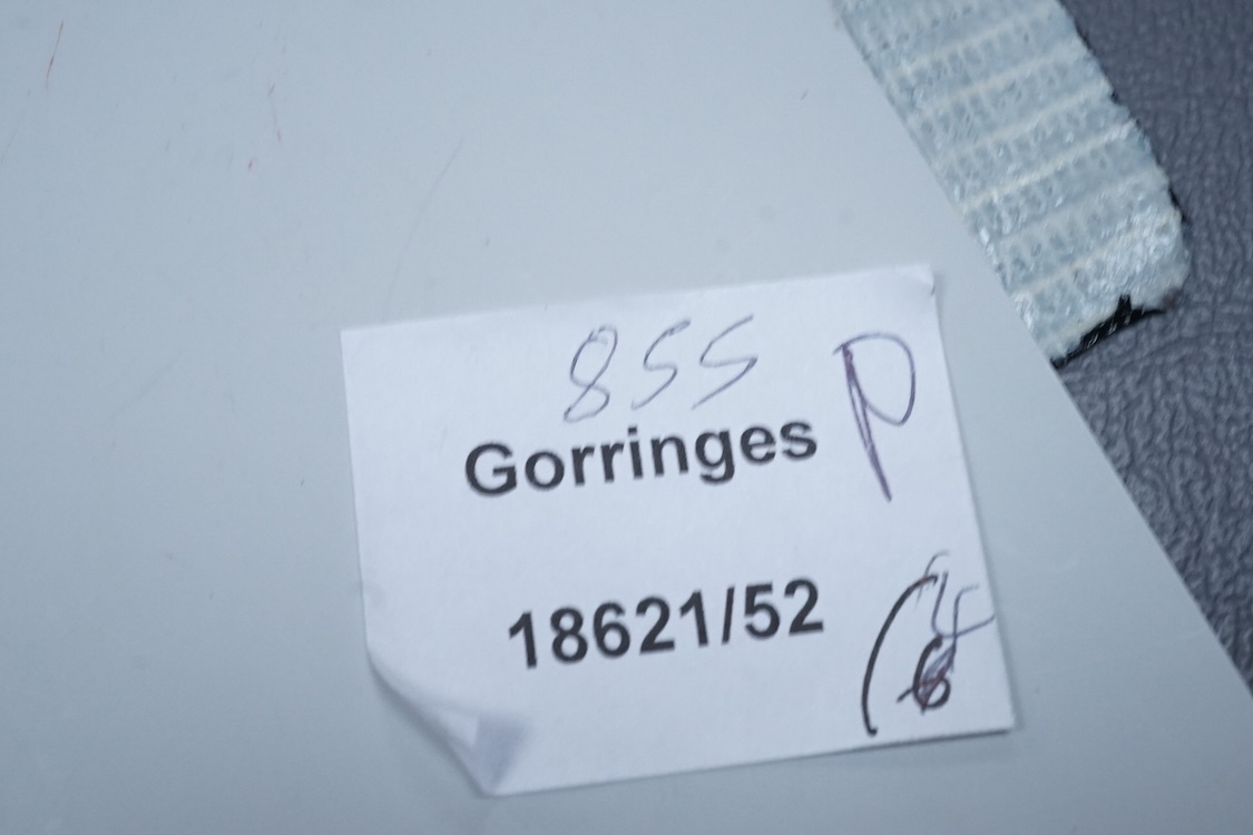 Two North American Edward I. Farmer of New York engraved sterling matchbox slides, one mounted with a jadeite carving, the other with polychrome enamelled surmount, both approximately 60mm.